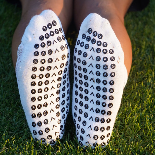 White Signature Grip Socks with SMALL cross